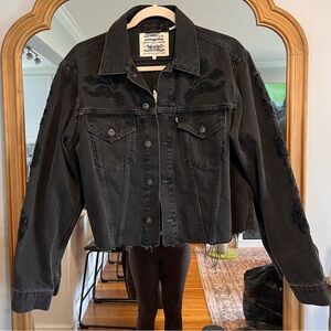 Levi’s black jean jacket with cut outs